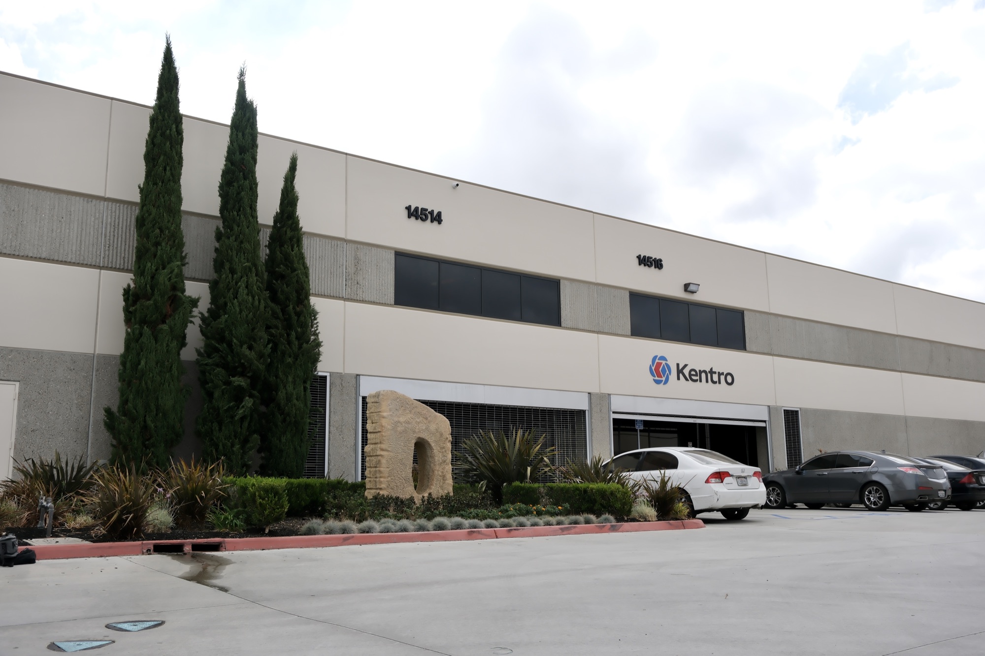 14514–14516 Garfield Ave building elevation with Kentro signage and tenant parking