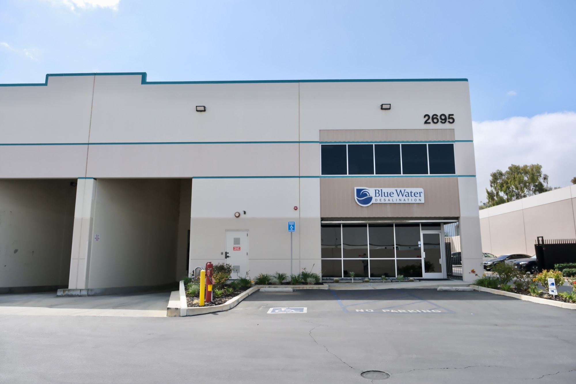 2695 Temple Ave entrance with Blue Water Desalination signage and ADA parking